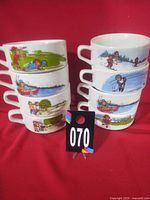 All eight soup cups stacked to display range of designs