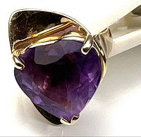 Heart-shaped amethyst in gold setting front view