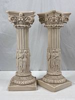 Full view of both matching Greek relief pedestal columns