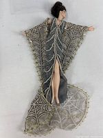 Full view of Erté Stardust porcelain doll showing gown and cape