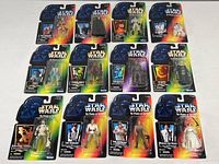 All 12 carded figures laid out