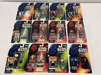 All 12 blister-carded figures laid out in three rows showing fronts