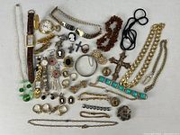 Group shot of all costume jewelry pieces spread on fabric background