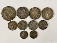 Obverse sides of ten assorted foreign silver coins displayed