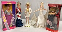 Group shot of all five Barbie dolls with packaging