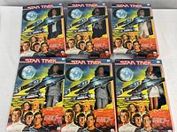 All six boxed Star Trek figures grouped