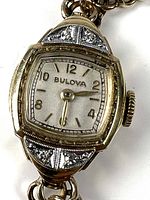Front view of Bulova watch showing dial, bezel, diamond accents