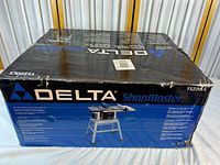 Boxed Delta ShopMaster TS220S table saw full package view