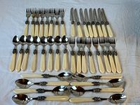 Full layout of 40-piece flatware set sorted by utensil type