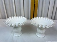 Both candlesticks side by side full view showing ruffled edges