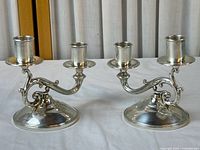 Both Fisher sterling weighted double-arm candlesticks front view
