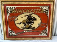 Full view of framed Winchester advertising sign