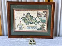 Overall view of framed Oahu map with stamp block beneath