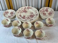 Full lot showing stacks of dinner plates, side plates, saucers and seven teacups