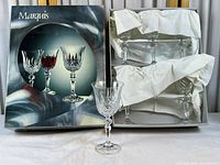 Retail box front showing Marquis branding and glass images