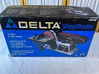 Retail box front with Delta ShopMaster belt/disc sander image and specifications
