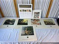 All items laid out: stamp pane board at back, overview board, six prints arrayed on table