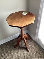 Full view of octagonal pedestal side table showing top, pedestal and legs