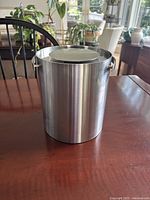 Ice bucket with lid on, showing exterior finish and handles