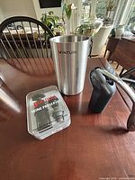 Vinturi cooler, Rabbit opener, Houdini preserver tin on table