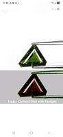 Triangular chrome tourmaline shown green and red under Chelsea filter