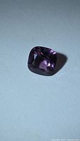 Cushion cut purple spinel angled view