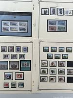 Composite of four album pages showing various stamp sets