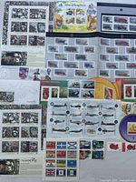 Overall lot showing multiple Canada Post stamp panes and souvenir sheets