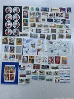 Overall view of mint Canadian stamps assortment on plastic sheet