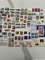 Entire spread of mint Canadian postage stamps and souvenir sheets