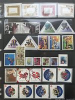 Full binder page showing multiple rows of Canadian stamps of various shapes and values