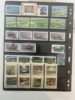 Front of Vario page with multiple rows of mint Canadian stamps showing agriculture scenes, vehicles and various commemoratives
