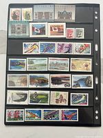 First stock page showing four rows of mint Canadian stamps of various designs