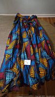 Full view of long multicolor print skirt with waistband tie