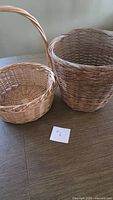 Handled basket and waste basket side by side