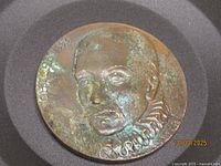 Obverse showing Montaigne portrait, year at rim, patina evident
