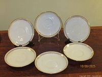 All six plates front view on display stand