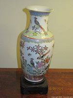 Vase on stand front view showing decoration