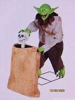 Fully assembled reference image of goblin thief holding sack with skull