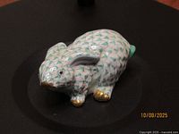 Left front view of Herend green fishnet rabbit figurine
