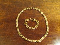 Bracelet and necklace laid out together