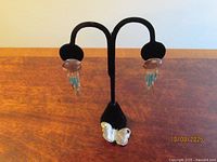 Brooch and earrings together for scale and style