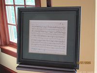 Full view of framed music manuscript print