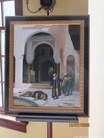 Full view of framed print on stand