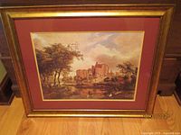 Full view of framed print showing gold frame and burgundy mat