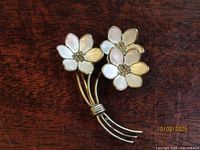 Front view showing enamel flowers and stems