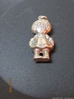 Front view of sterling Raggedy Ann charm
