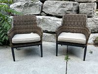 Front view of both wicker chairs with cushions