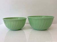Both 8" and 9" Jadite bowls side by side exterior view