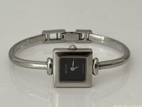 Front view of Gucci 1900L stainless steel bracelet watch showing dial, crown, and clasp